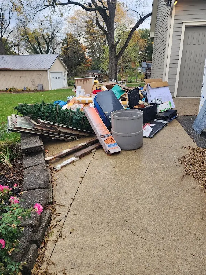 Dumpster being loaded with debris for 10 Yard Dumpster Rental in Wedgefield